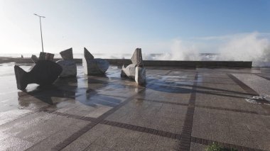 OVAR, PORTUGAL - 30 JANUARY 2025: The sea rises to the seafront of Furadouro in Ovar during the Ivo Storm. The advance of the sea due to climate change threatens Portugal. clipart