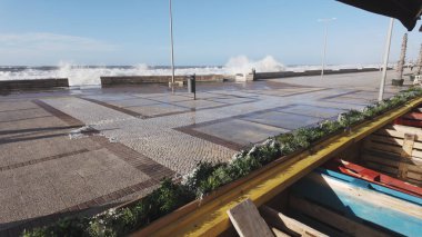 OVAR, PORTUGAL - 30 JANUARY 2025: The sea rises to the seafront of Furadouro in Ovar during the Ivo Storm. The advance of the sea due to climate change threatens Portugal. clipart