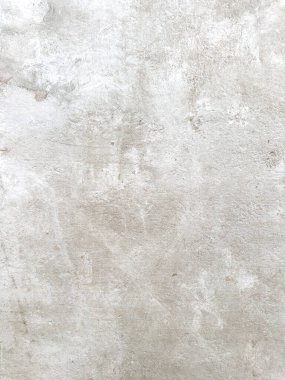 Soluk, benekli gri bir dokuya sahip soyut arkaplan, örtüler ve dijital tasarımlar için uygun biraz kaba, taş benzeri bir görünüm sergiliyor