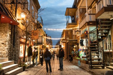 Quebec City, Canada - November 7, 2022:  View of historic lower Quebec City in Canada seen at night with people and lights