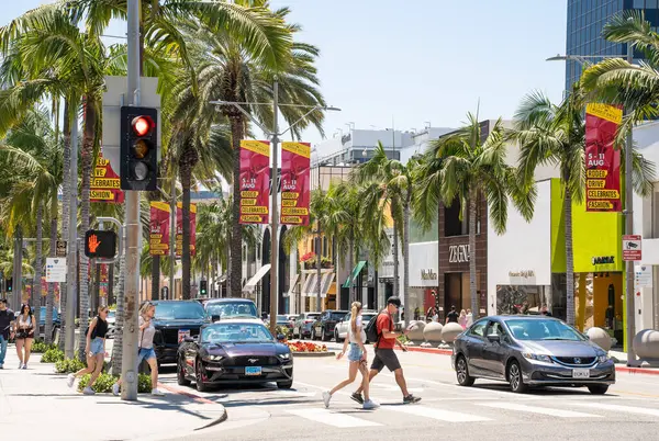 stock image Beverly Hills, California - June 29, 2024:  Street scene on Rodeo Drive in Beverly Hills California with people and stores.