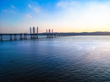 Mario Cuomo Bridge, formerly known as the Tappan Zee Bridge in Westchester County New York State seen at sunset over the Hudson River.
