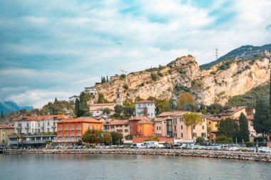 Lake Garda Italy with lake, mountains and historic town in view. clipart