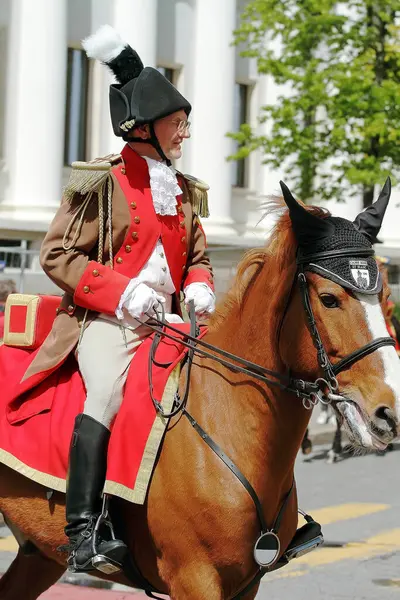 stock image GENEVA; SWITZERLAND-May 04, 2024: Cavalryman street parade participant in the Friborg Black and White Guards uniform. Old Grenadiers March, 275-years anniversary of the Vieux Grenadiers society, May 04, 2024