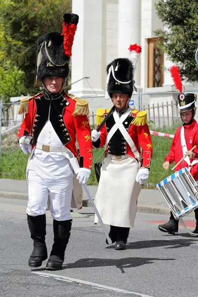 stock image GENEVA; SWITZERLAND-May 04, 2024: Historical Militia of Leontica officer with saber leads a infantry detachment. Old Grenadiers March, Vieux Grenadiers society 275-years anniversary, May 04, 2024