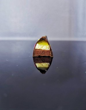 Handmade chocolate bonbons in colorful glaze with assorted fillings  unwrapped artisan sweets