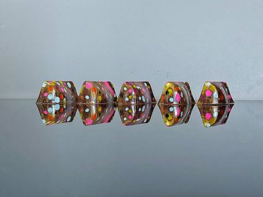Handmade chocolate bonbons in colorful glaze with assorted fillings  unwrapped artisan sweets