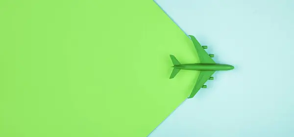 stock image Sustainable aviation concept - green plane. Banner image, copy space.