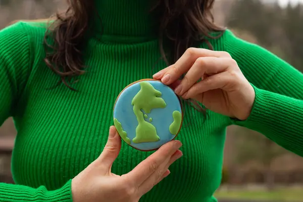 Earth Day Concept Gingerbread Shape Planet Hands Woman Stock Image