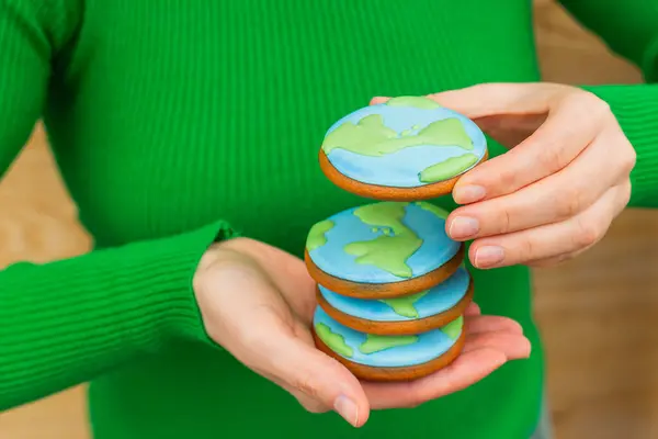 Earth Day Concept Stack Cookies Shape Earth Female Hands Royalty Free Stock Photos