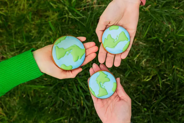 Earth Day Concept Hands Hold Gingerbread Shape Earth Care Environment Stock Photo