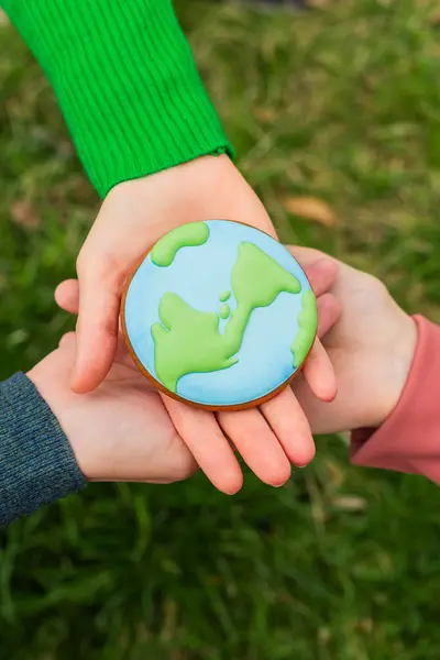 Earth Day Concept Hands Hold Gingerbread Shape Earth Care Environment Stock Image