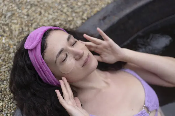 Woman Pink Headband Laying Inn Spa Eye Patches Stock Image