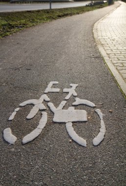 Bicycle path with white bike symbol painted on it