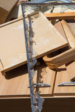 Pile of old furniture and a frame of a broken mirror, outdoor