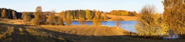 stock image autumn view of pond with reflection of colorful autumn forest landscape, Divka pond, Hamry nad Sazavou, Bohemian and Moravian highlands, Czech Republic 