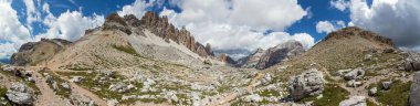 Valley Val Travenanzes and rock face in Tofane gruppe, Mount Tofana de Rozes, Alps Dolomites mountains, Fanes national park, Italy clipart