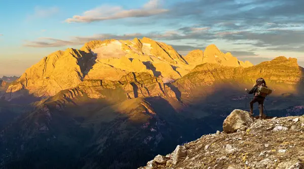 stock image morning panoramic view of mount Marmolada with hiker, South Tyrol, Alps Dolomites mountains, Italy