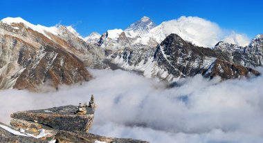 View of mount Everest, Lhotse and Makalu from gokyo peak with stone pyramid, way to Mt Everest base camp, three passes trek, Nepal Himalayas mountains