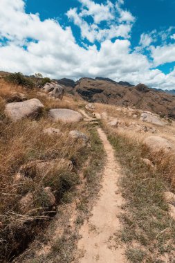 Andringitra national park, Haute Matsiatra region, Madagascar, beautiful mountain landscape with trail to peak and massifs. Hiking in Andringitra mountains. Madagascar wilderness landscape.