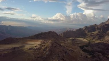 Andringitra national park,mountain landscape. View from above. Top drone video of sunset mountain panorama and valley with dramatic sky. Madagascar hill wilderness.