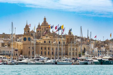 Medieval Malta: Birgu and Vittoriosa skyline, Malta, features iconic churches, historic buildings and narrow streets in Malta. Cultural heritage of Malta clipart