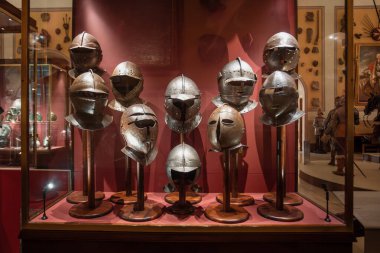 Valletta, Malta - May 12, 2024: A captivating display of historic helmets at the Grandmaster's Palace, showcasing the rich history of warfare. clipart