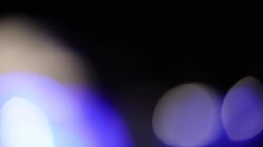 Optik ışıltı bokeh ışığı farklı uygulamalar ve ekran harmanlama kipleri ve geçiş arkaplanı olan projeler için 4K görüntü sızdırır