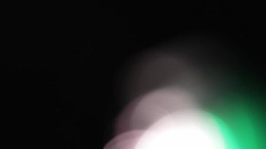 Optik ışıltı bokeh ışığı farklı uygulamalar ve ekran harmanlama kipleri ve geçiş arkaplanı olan projeler için 4K görüntü sızdırır