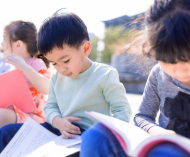 Happy kids studying at school
