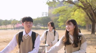 Teenager students walking together in the school