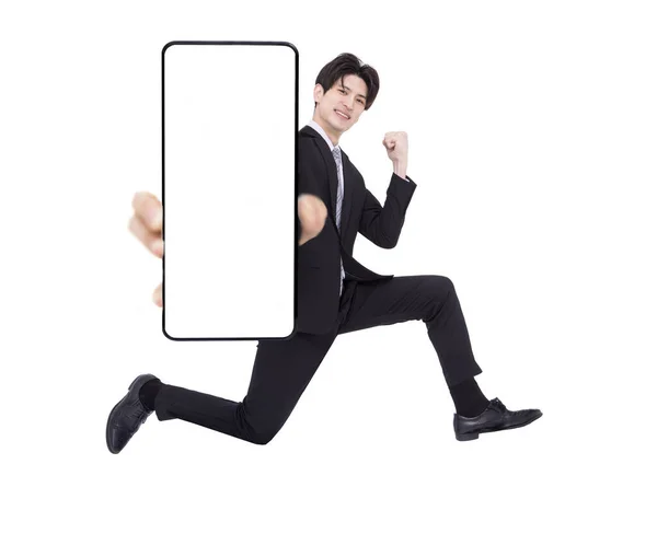 Happy Young Business Man Jumping Showing Blank Mobile Phone Screen — Stock Photo, Image