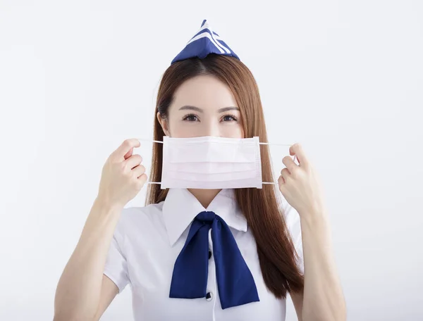 Młoda Kobieta Stewardesa Mundurze Białą Maską — Zdjęcie stockowe