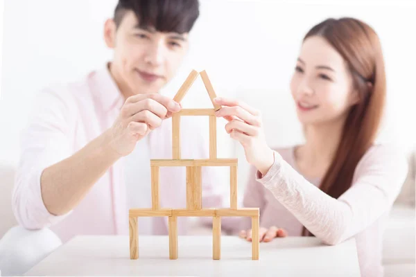 Happy Young Couple Building House Wooden Bricks Home Concept — Stock Photo, Image