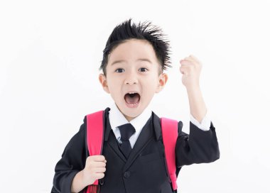 Excited Boy in student uniform isolated on white background