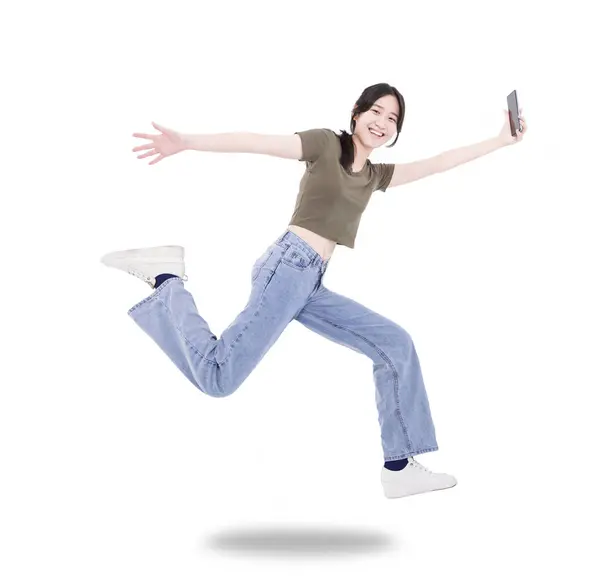 Ευτυχισμένο Κορίτσι Φοιτητής Κρατήσει Κινητό Τηλέφωνο Άλμα Και Τρέξει Φορούν Εικόνα Αρχείου