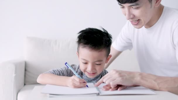 Young Father Checking Homework Helping Child Study Home — Wideo stockowe