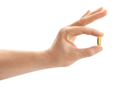 Vitamin hapı beyaz yolda izole edilmiş.