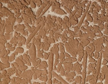 Surface puttied with decorative putty as a background. Preparation of facade walls