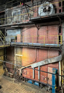 Grate-fired coal boiler producing steam made in the old technology of heavy walls, made of brick,