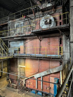Grate-fired coal boiler producing steam made in the old technology of heavy walls, made of brick,