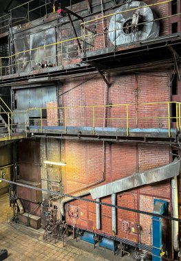 Grate-fired coal boiler producing steam made in the old technology of heavy walls, made of brick,