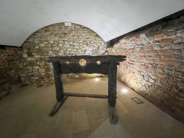 Rabsztyn, Poland, February 17, 2024: Old stocks - a torture device located in the ruins of the Rabsztyn castle near Olkusz in Poland. clipart