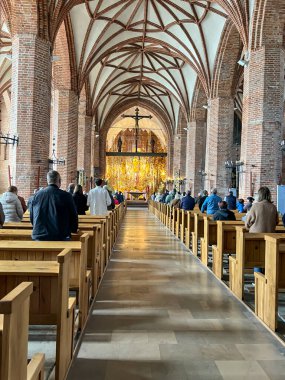 Gdansk, Poland, May 12, 2024: Amber altar in the church of St. Bridget in Gdansk, Poland. Patriotic traditions were cultivated in the church. clipart