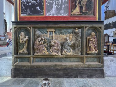 Gdansk, Poland, May 12, 2024: St. Mary's Basilica in Gdansk - fragment of the interior. Jesus praying in the olive garden, Gethsemane - bas-relief at the back of the main altar. clipart