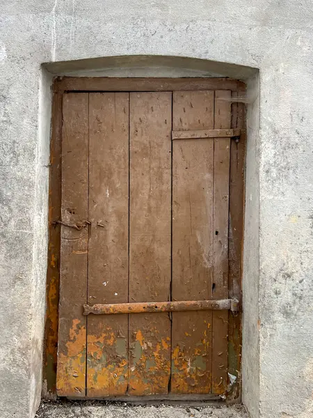 stock image Very worn doors to old utility rooms in the period before the demolition of these rooms.