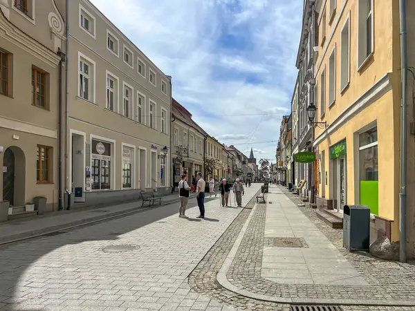 stock image Chelmno, Poland, May 6, 2024: One of the main streets in Chelmno, Poland. The quiet life of a small town with historic buildings, the city of lovers.