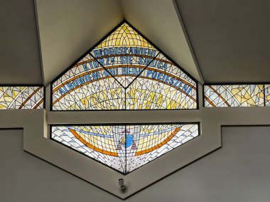 Siedlec, Poland, July 23, 2024: Sanctuary of Saint Padre Pio on Przeprosna Gorka near Czestochowa. Stained glass window in the upper church with the blessing: 