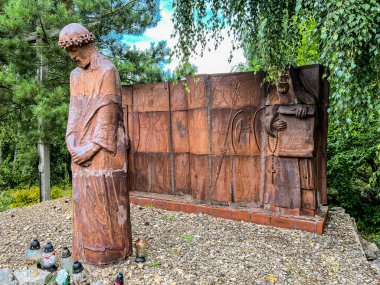 Siedlec, Poland, July 23, 2024: Sanctuary of Saint Padre Pio - a sanctuary located on Przeprosna Gorka in Siedlec. Way of the Cross with Padre Pio, Station 1. Jesus sentenced to death. clipart