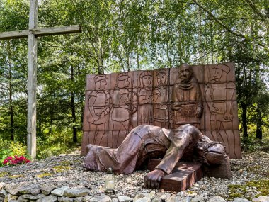 Siedlec, Poland, July 23, 2024: Sanctuary of Saint Padre Pio - a sanctuary located on Przeprosna Gorka in Siedlec. The Way of the Cross with Padre Pio, Station 7. The second fall of the Lord Jesus. clipart